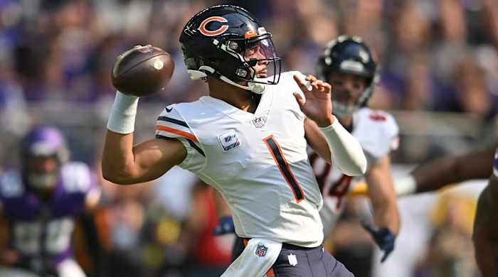 Oct 9, 2022; Minneapolis, Minnesota, USA; Chicago Bears quarterback Justin Fields (1) throws a pass against the Minnesota Vikings during the first quarter at U.S. Bank Stadium.